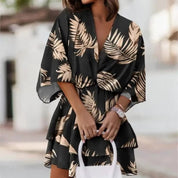 Minivestido floral negro con estampado de hojas